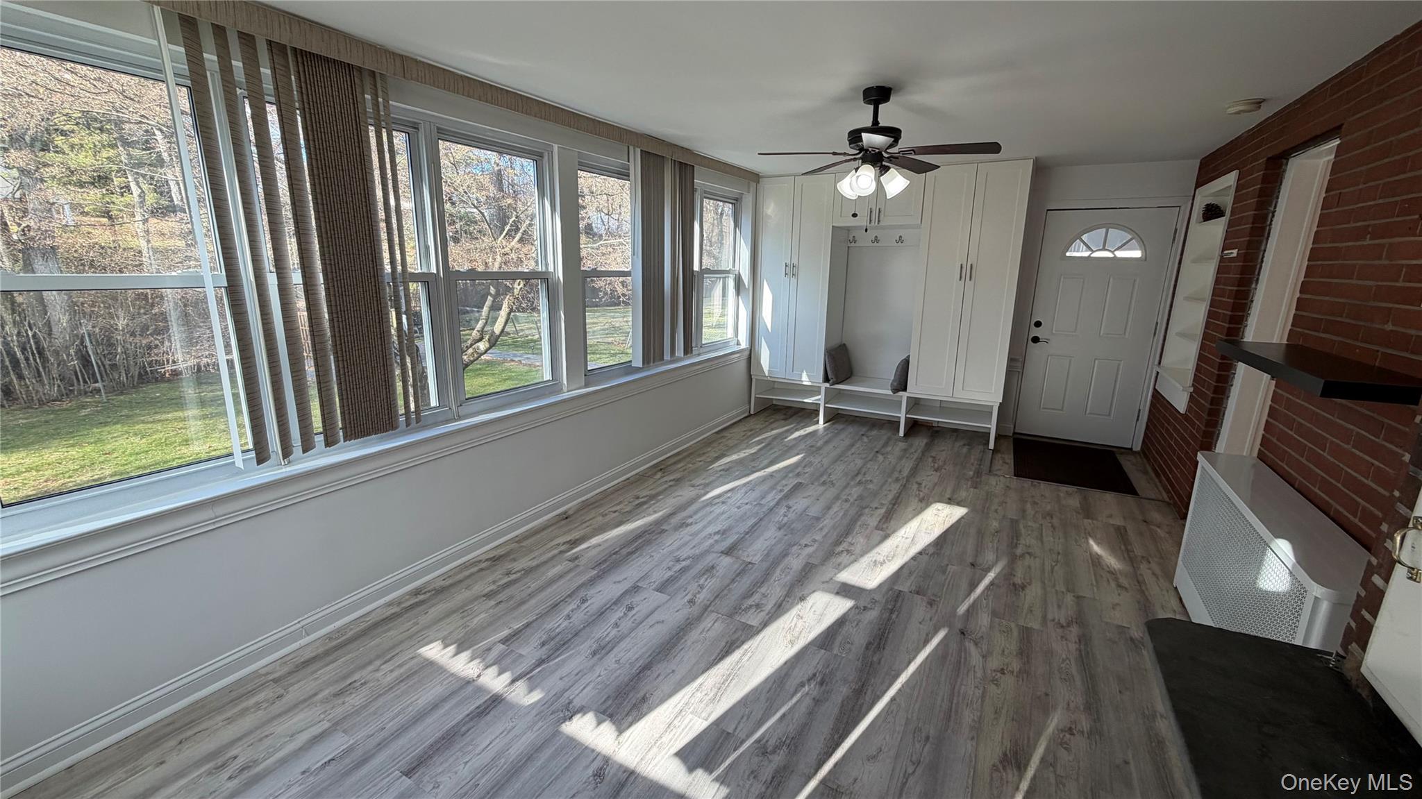 2 Wyman Street, Unit 1 Rye Brook, NY 10573 - Photo 5 of 13 a view of an empty room with wooden floor and a window