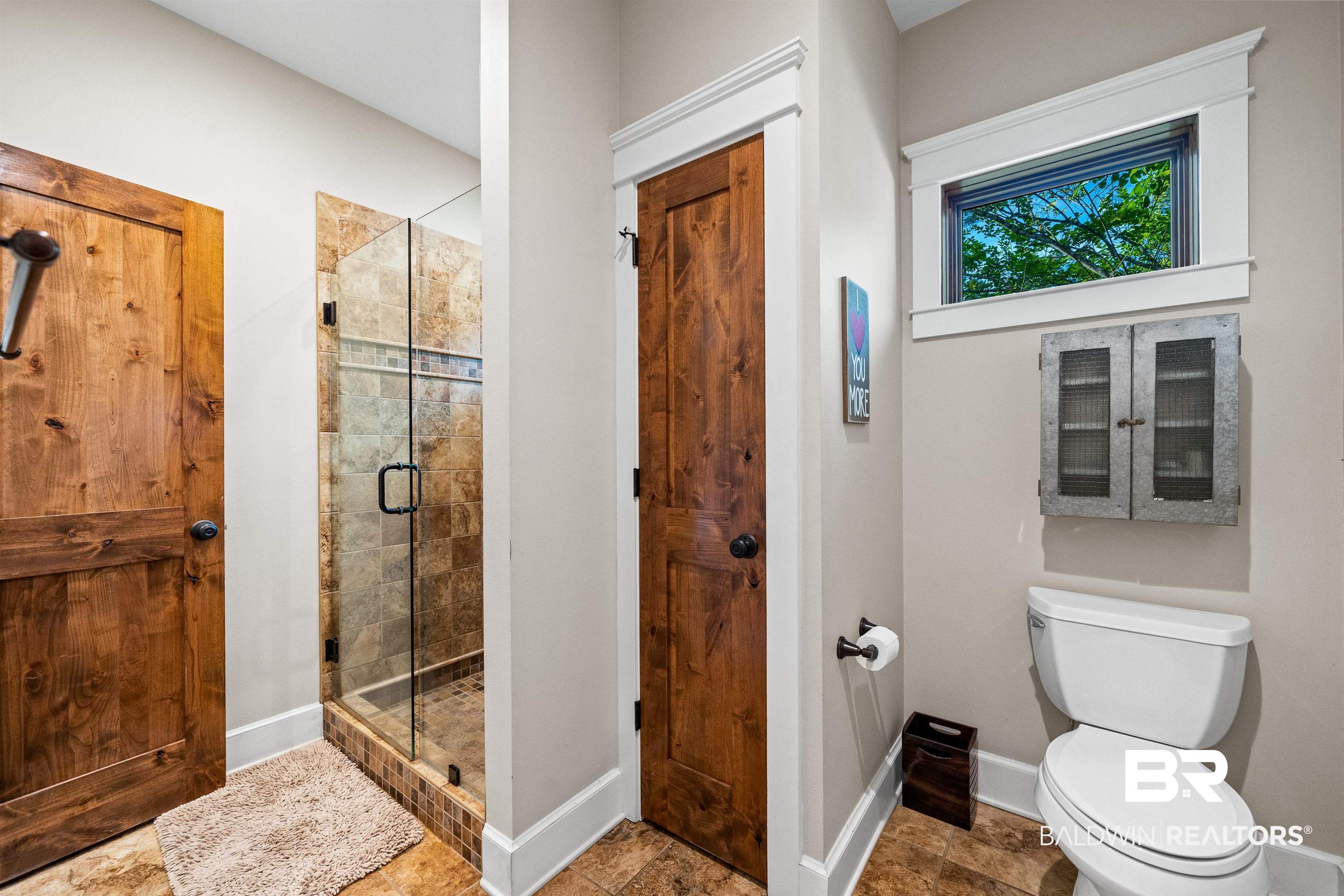 47252 Emmons Road Bay Minette, AL 36507 - Photo 29 of 50 Bathroom featuring a shower stall and stone finish floors