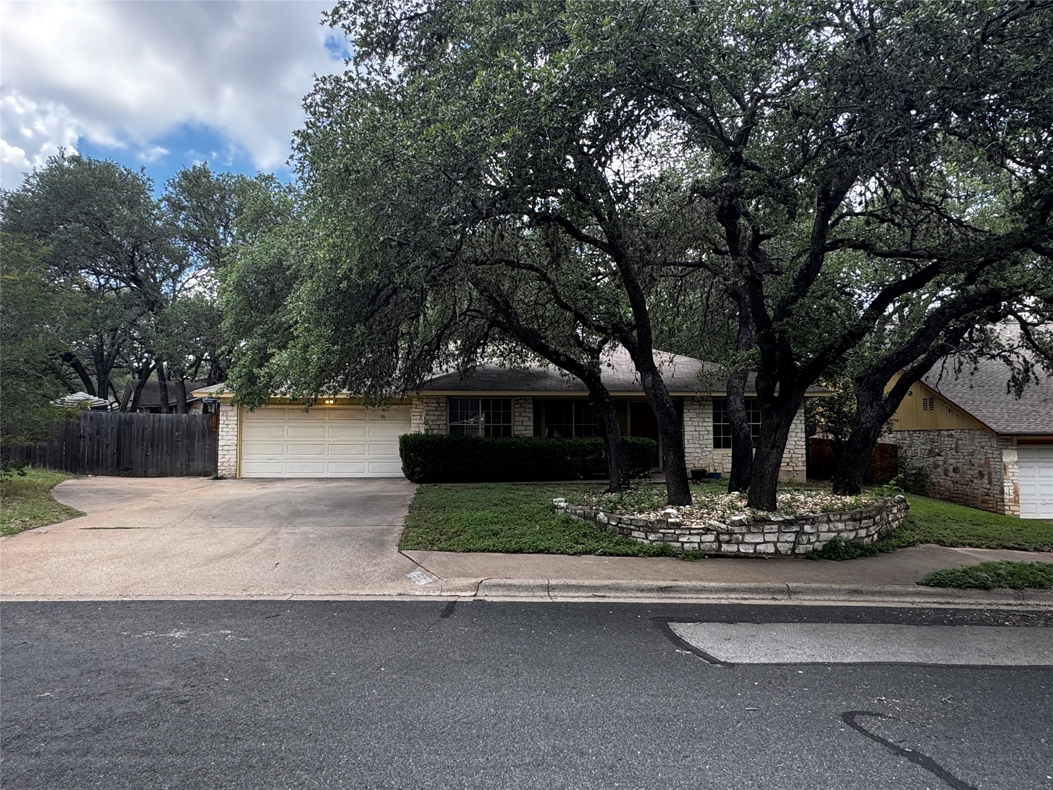 4504 Langtry Lane Austin, TX 78749 - Photo 1 of 1 Mature trees shade this charming residence with an integrated garage and a classic stone facade.