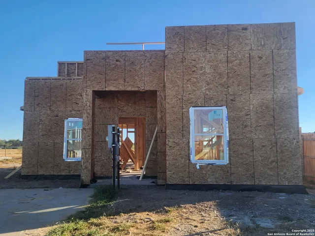a front view of a house with yard