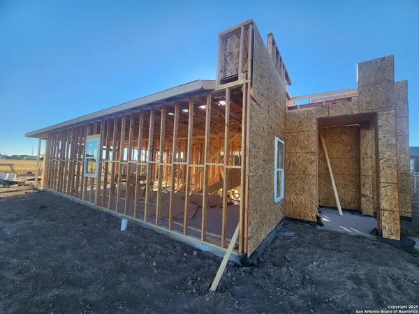 a view of a house with wooden deck