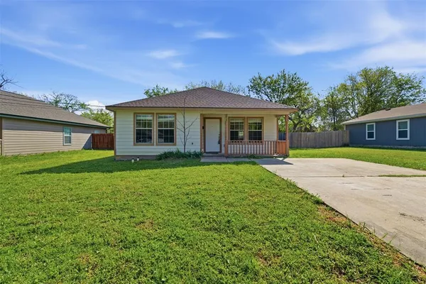 front view of a house with a yard