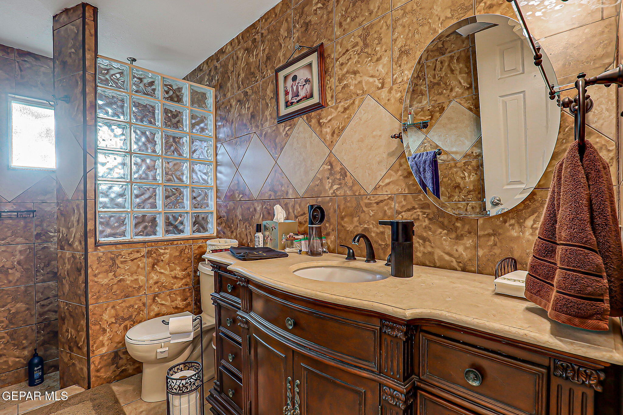 14800 Kingston Road Horizon City, TX 79928 - Photo 17 of 82 a bathroom with a granite countertop toilet sink and mirror