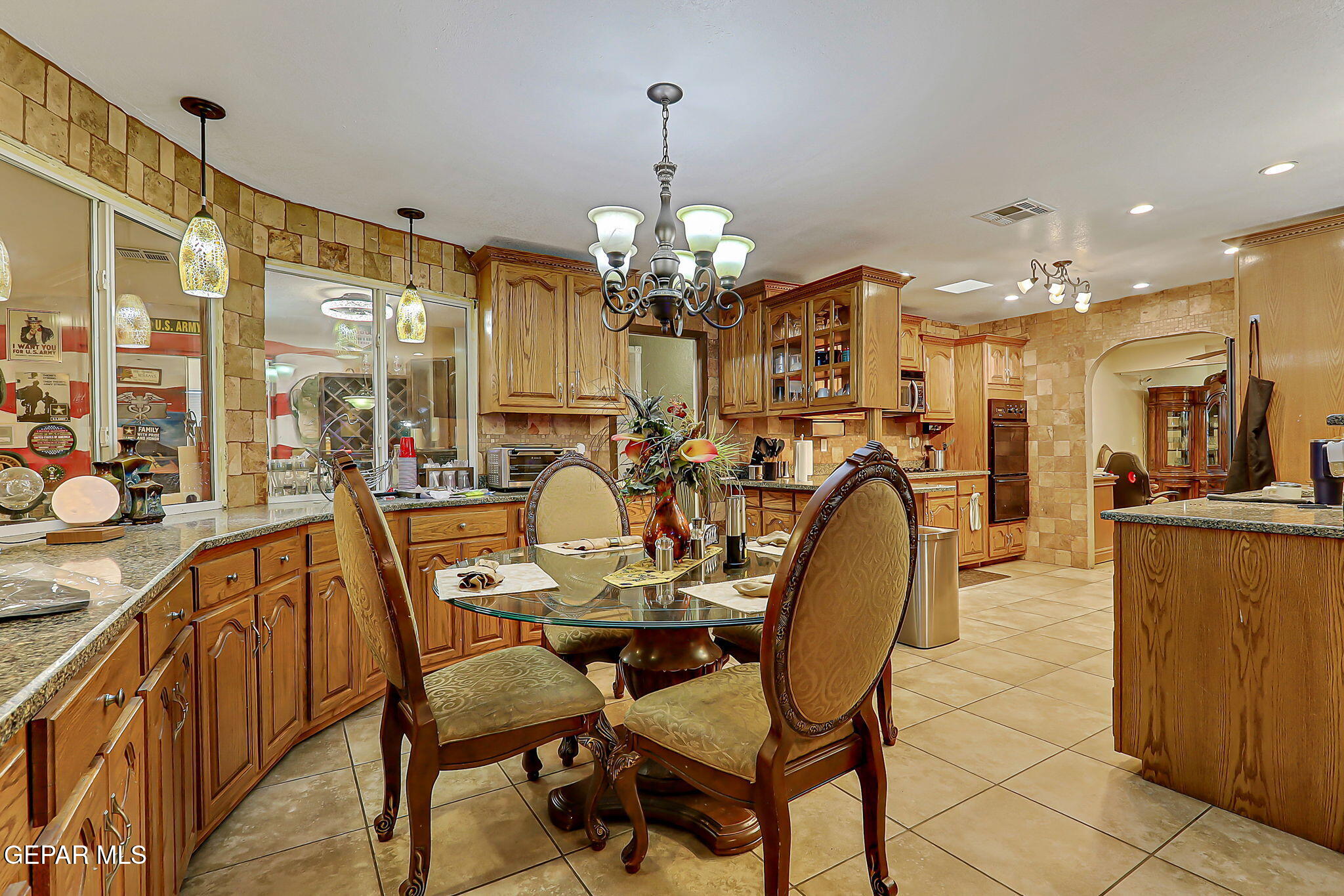 14800 Kingston Road Horizon City, TX 79928 - Photo 22 of 82 a view of a dining room with furniture and chandelier