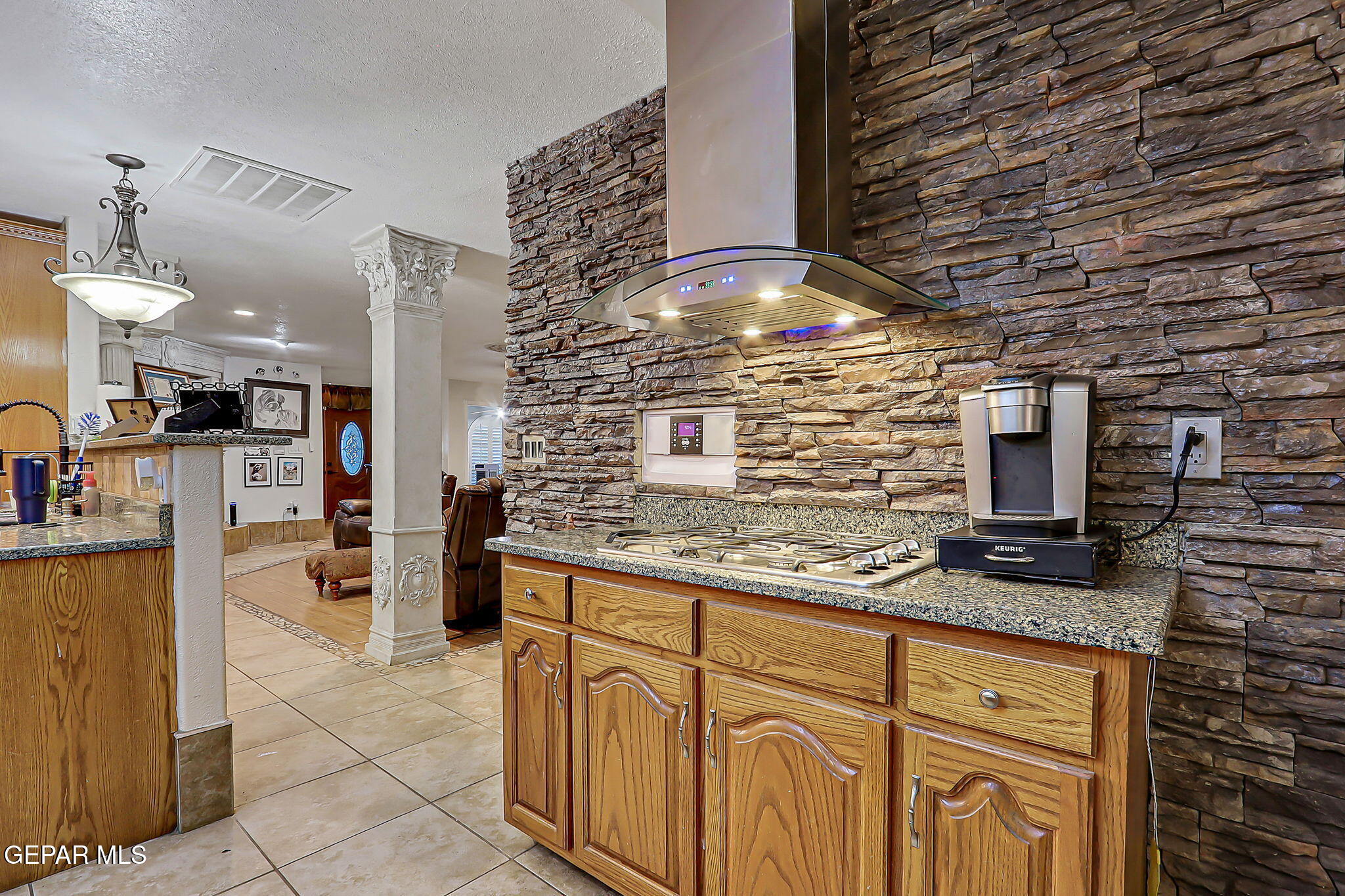 14800 Kingston Road Horizon City, TX 79928 - Photo 23 of 82 a kitchen with stainless steel appliances kitchen island granite countertop a stove and cabinets