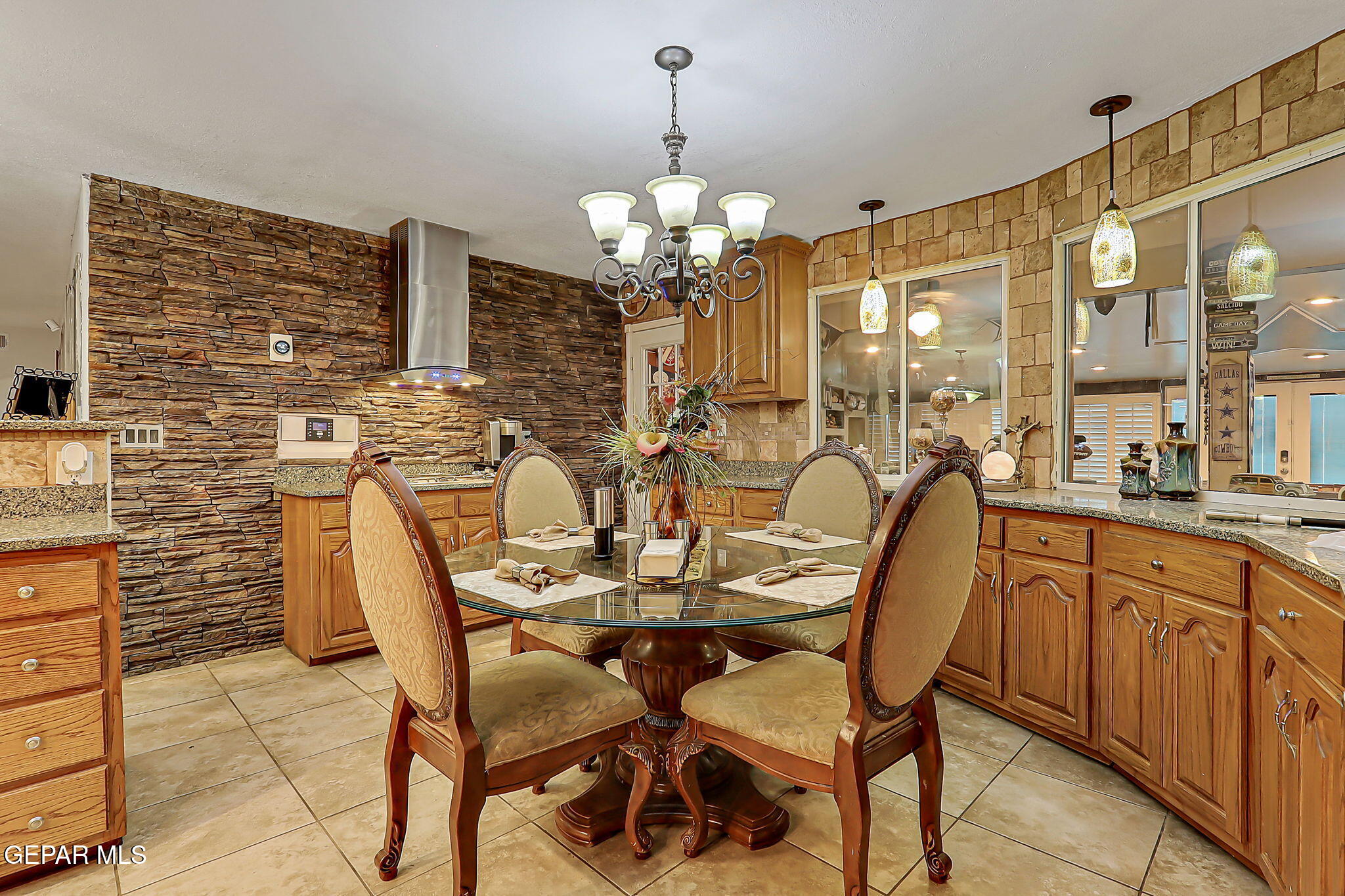 14800 Kingston Road Horizon City, TX 79928 - Photo 26 of 82 a view of a dining room with furniture and a chandelier