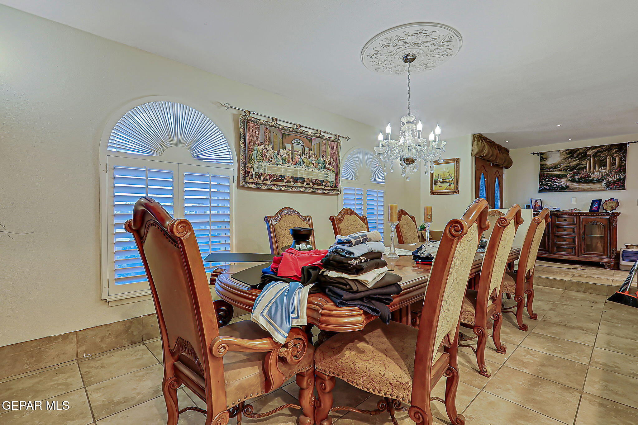 14800 Kingston Road Horizon City, TX 79928 - Photo 33 of 82 a view of a dining room with furniture and chandelier