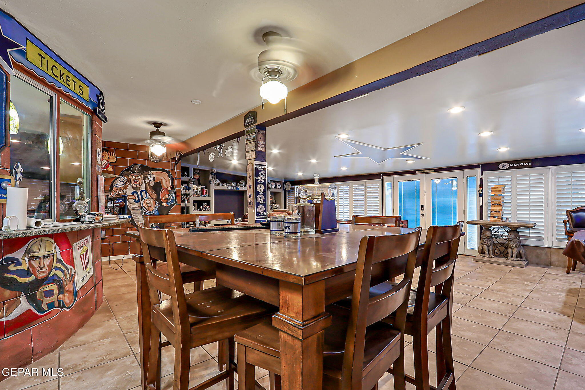 14800 Kingston Road Horizon City, TX 79928 - Photo 47 of 82 a view of a dining area with furniture and a chandelier