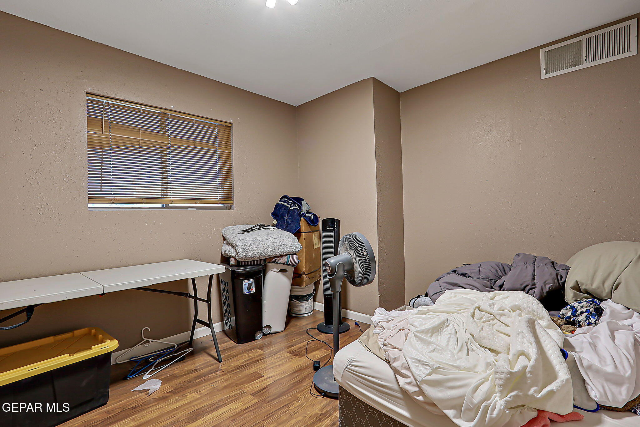 14800 Kingston Road Horizon City, TX 79928 - Photo 51 of 82 a bedroom with a bed and wooden floor