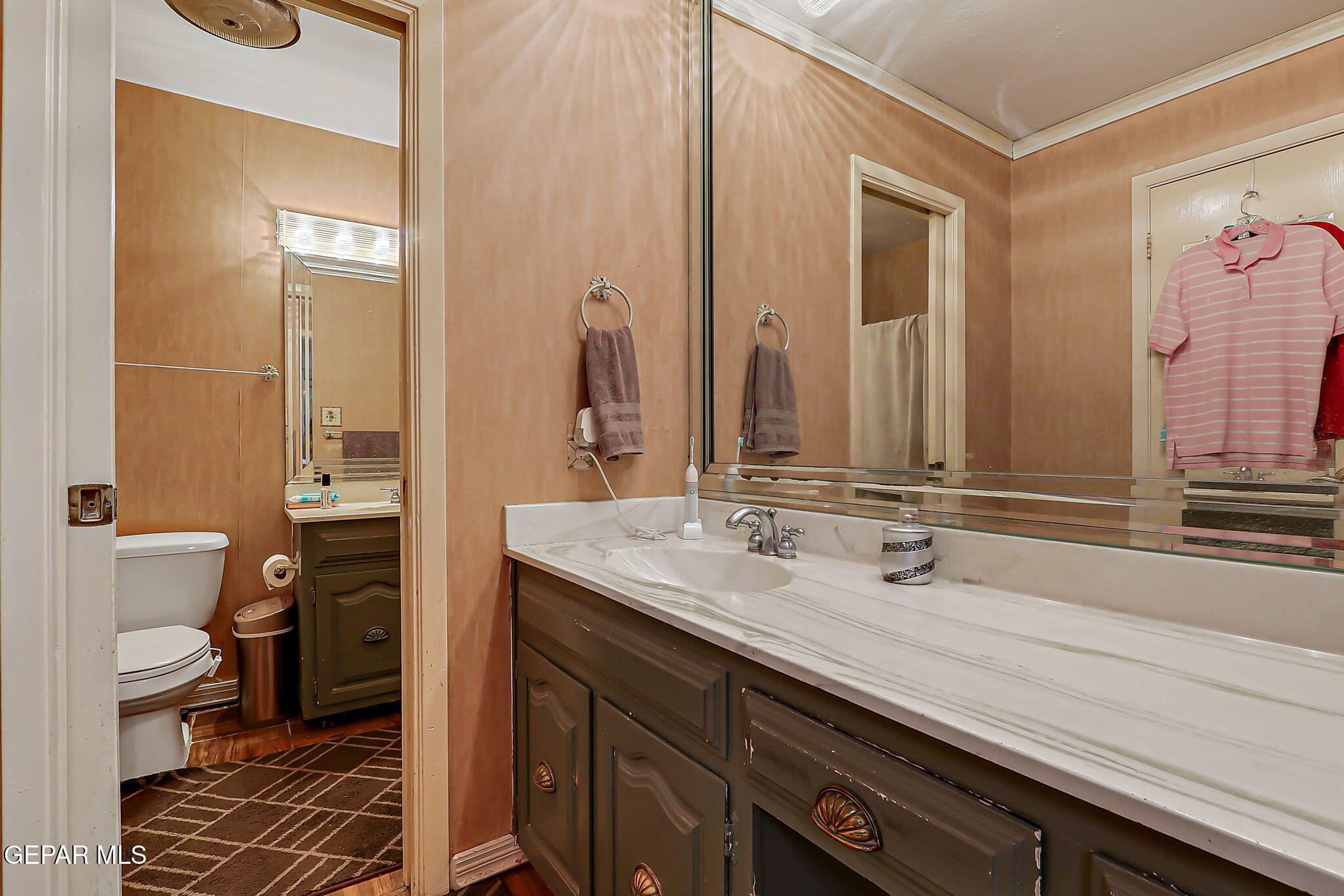 14800 Kingston Road Horizon City, TX 79928 - Photo 52 of 82 a bathroom with a double vanity sink toilet and a mirror