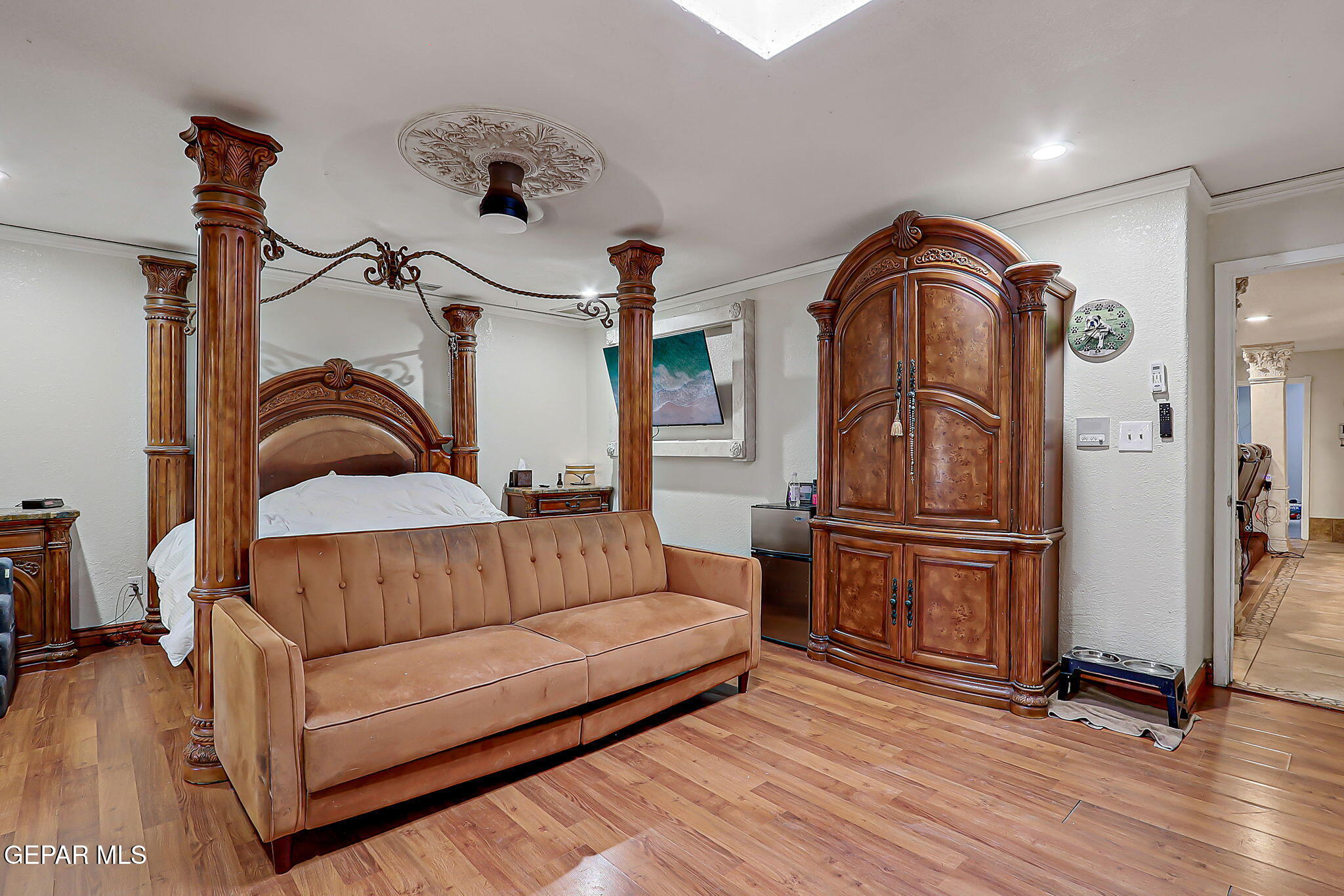 14800 Kingston Road Horizon City, TX 79928 - Photo 58 of 82 a spacious bedroom with a bed and wooden floor