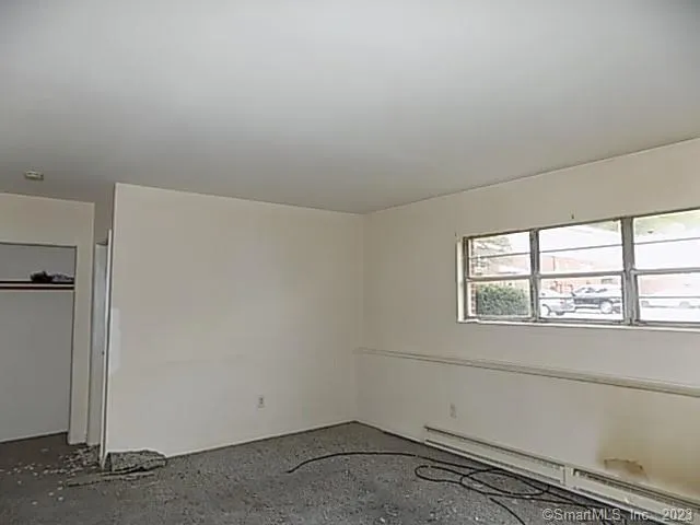 a view of a room that has a window in it