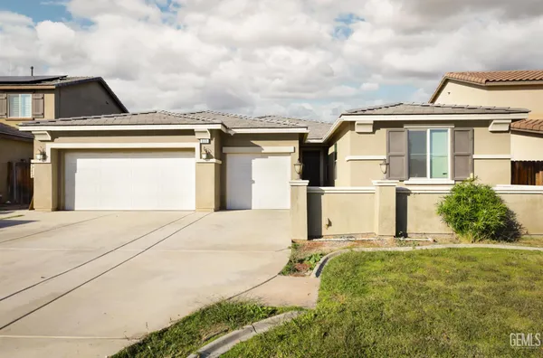 a front view of a house with a garage