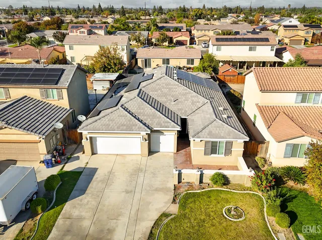 an aerial view of a house with a swimming pool