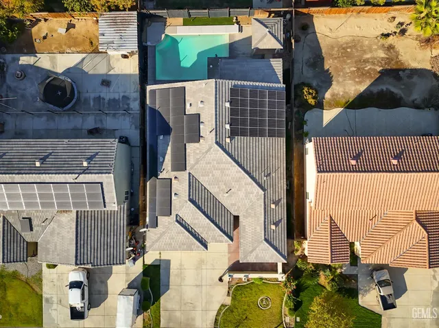 an aerial view of residential houses with outdoor space