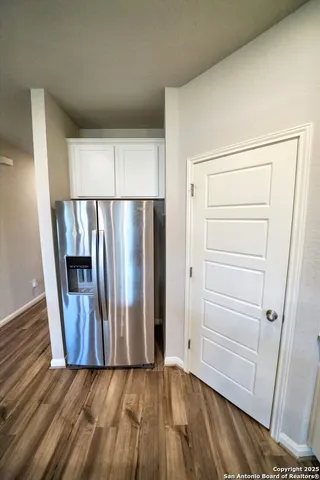 a kitchen with granite countertop a sink a vanity granite and a mirror