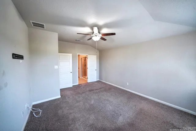 a bathroom with a double vanity sink and mirror