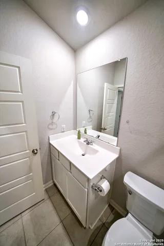 a bathroom with a sink and toilet