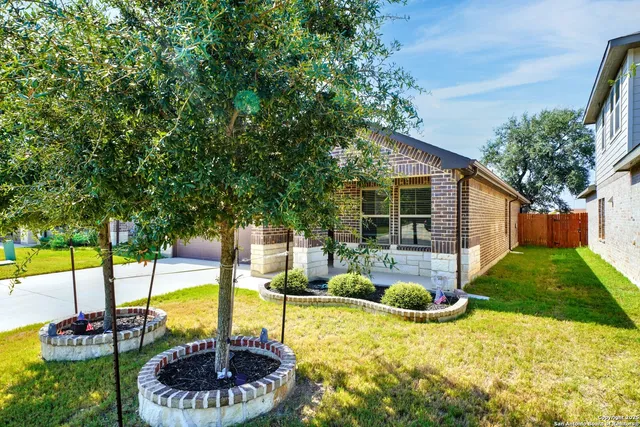 a view of a backyard with swimming pool