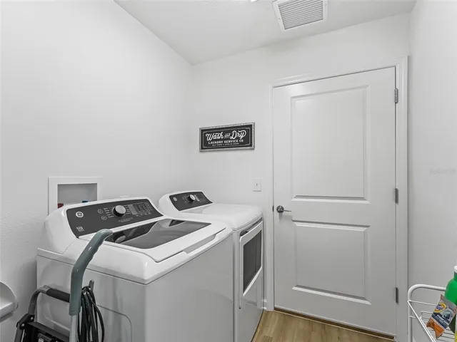 a utility room with dryer and washer