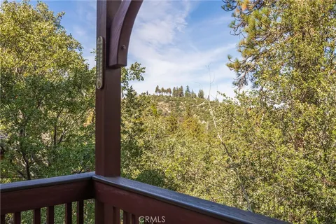 a view of a wooden fence with a tree
