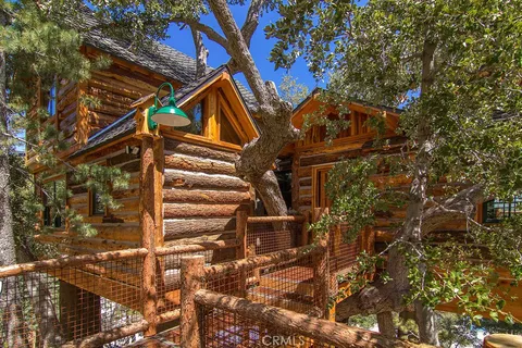 a view of a house with a tree