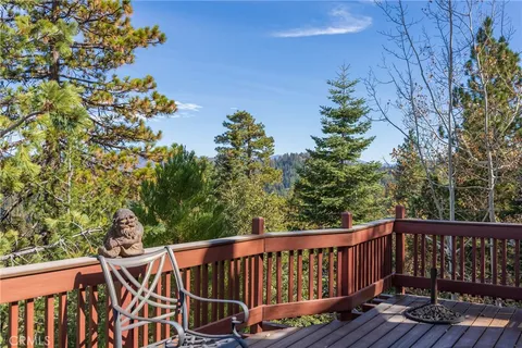 a view of a wooden deck with a garden