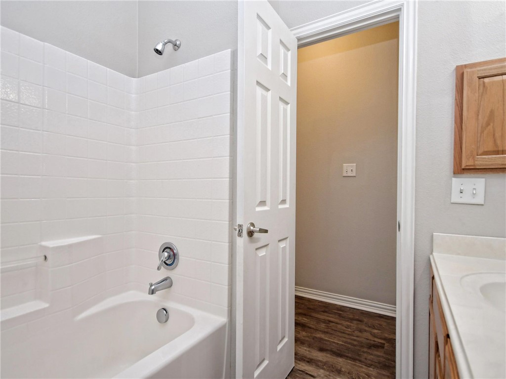 1001 Krenek Tap Road, Unit 2002 College Station, TX 77840 - Photo 13 of 20 a bathroom with a bathtub and a shower