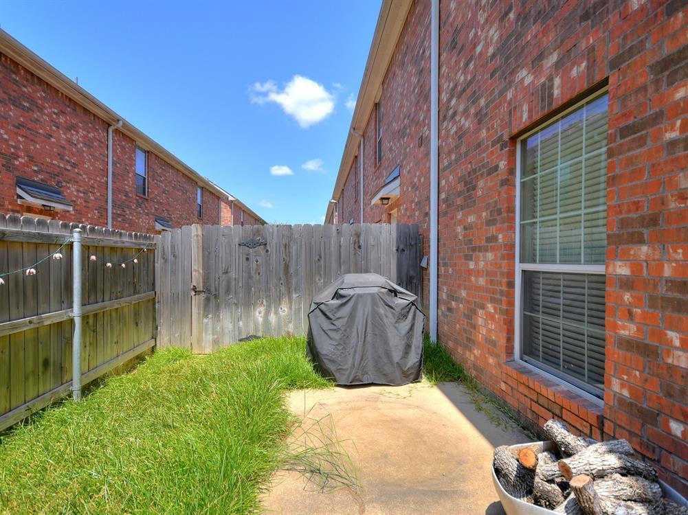 1001 Krenek Tap Road, Unit 2002 College Station, TX 77840 - Photo 19 of 20 a backyard of a house with lots of green space