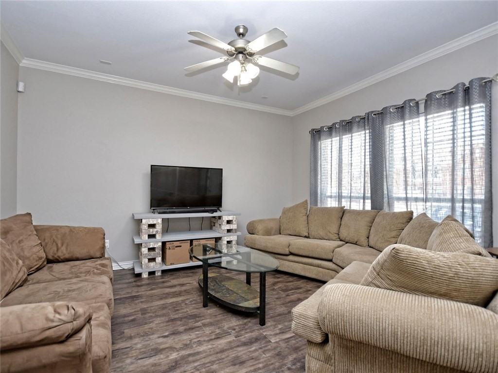 1001 Krenek Tap Road, Unit 2002 College Station, TX 77840 - Photo 4 of 20 a living room with furniture and a flat screen tv