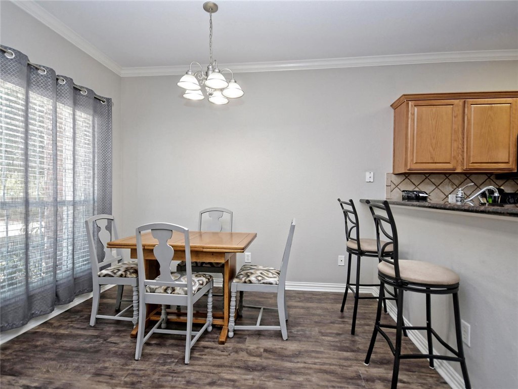 1001 Krenek Tap Road, Unit 2002 College Station, TX 77840 - Photo 6 of 20 a view of a dining room with furniture window and wooden floor