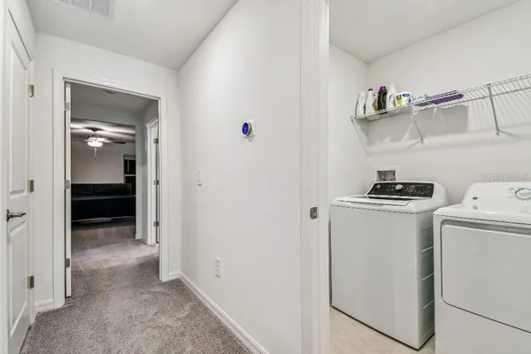 a kitchen with a refrigerator a stove and a sink