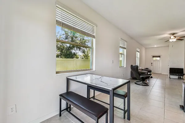 a kitchen with stainless steel appliances granite countertop a stove top oven a sink and a refrigerator