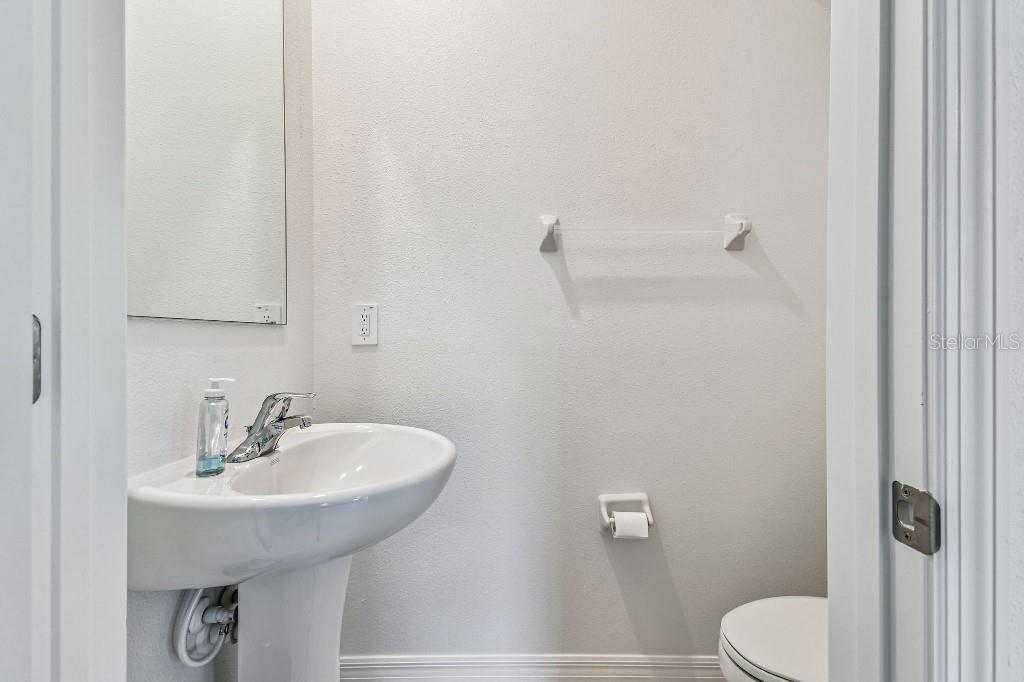 8331 Corner Pine Way New Port Richey, FL 34655 - Photo 24 of 41 a bathroom with a sink and a toilet