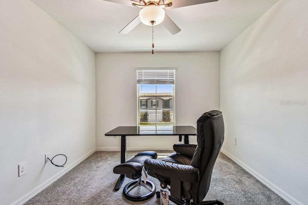 8331 Corner Pine Way New Port Richey, FL 34655 - Photo 27 of 41 a view of a workspace with furniture and a window