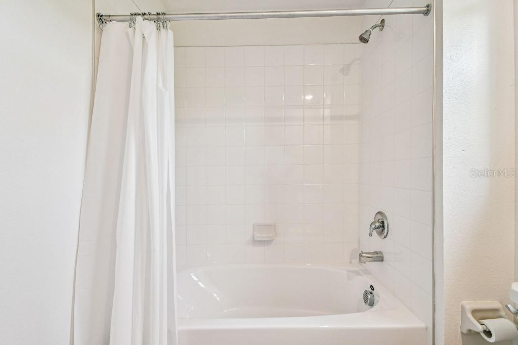 8331 Corner Pine Way New Port Richey, FL 34655 - Photo 30 of 41 a bathroom with a bathtub