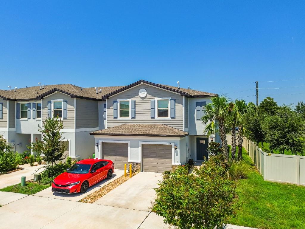 8331 Corner Pine Way New Port Richey, FL 34655 - Photo 3 of 41 a house view with a garden space