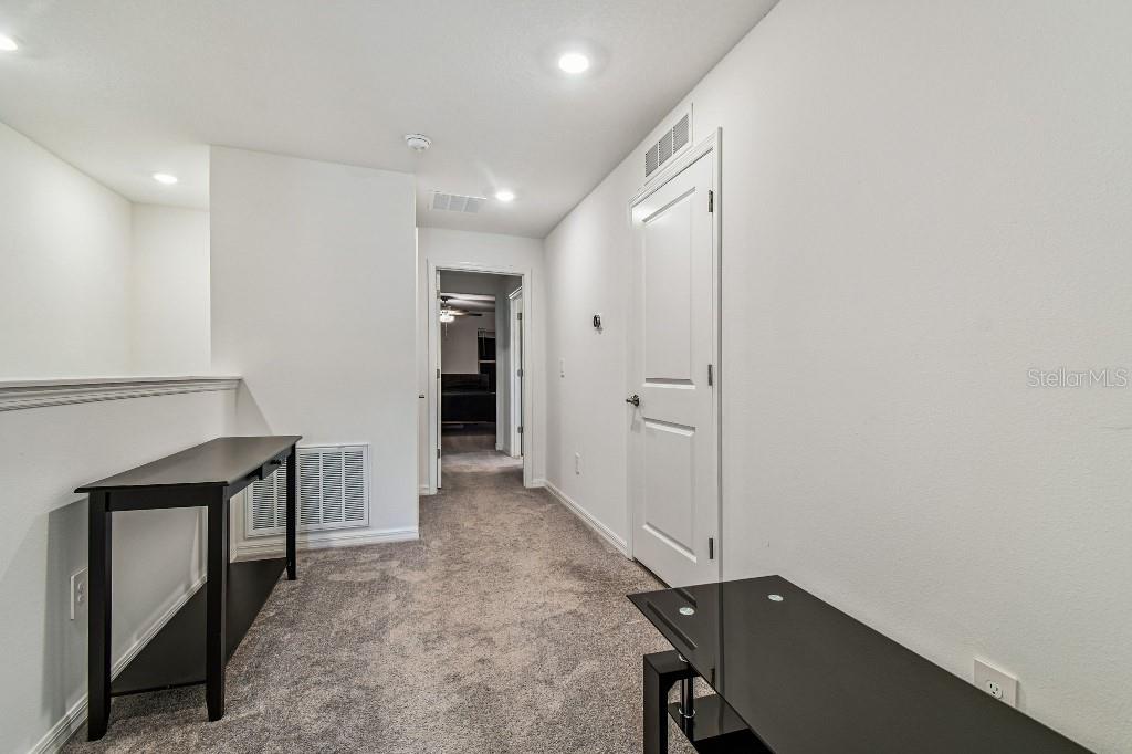 8331 Corner Pine Way New Port Richey, FL 34655 - Photo 31 of 41 a view of a hallway with closet