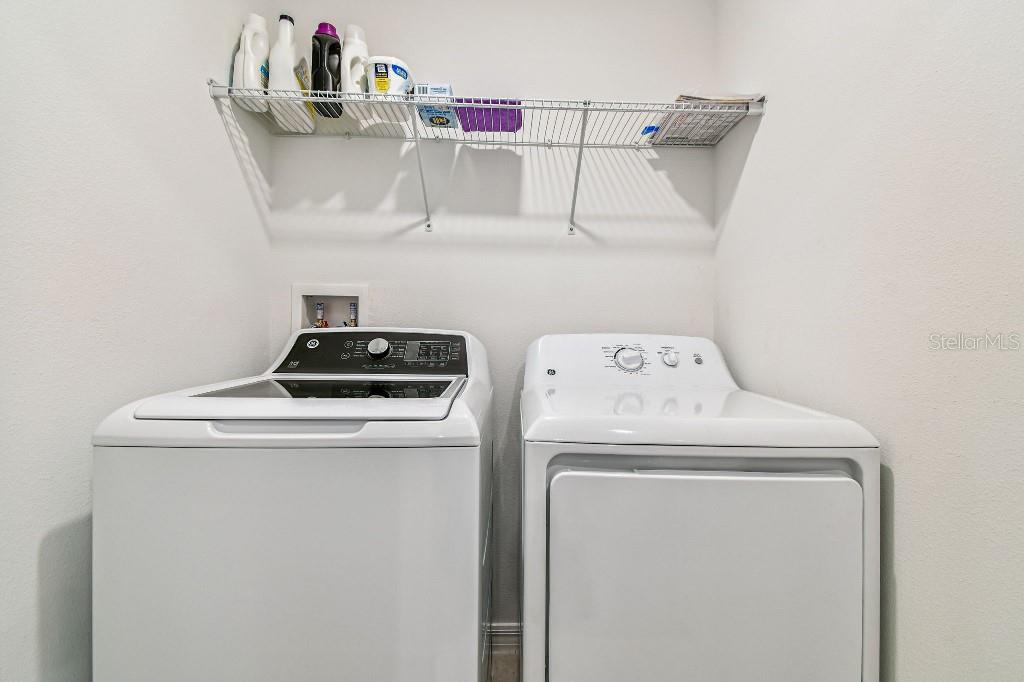 8331 Corner Pine Way New Port Richey, FL 34655 - Photo 32 of 41 a utility room with dryer and washer