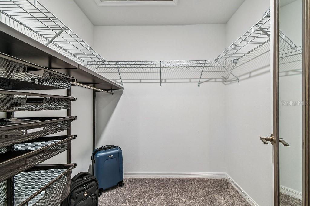 8331 Corner Pine Way New Port Richey, FL 34655 - Photo 33 of 41 a view of a storage & utility room with racks on the wall