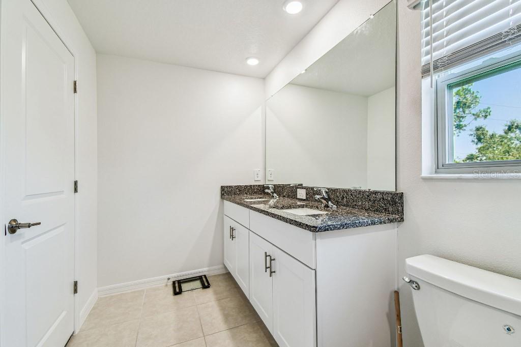 8331 Corner Pine Way New Port Richey, FL 34655 - Photo 37 of 41 a kitchen with a stove and a sink