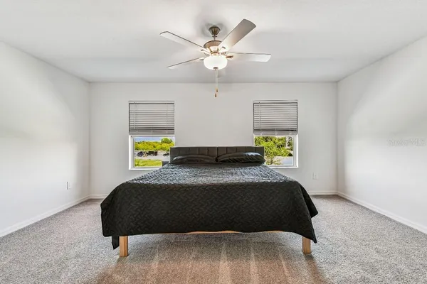 an aerial view of a house with a swimming pool yard and outdoor seating