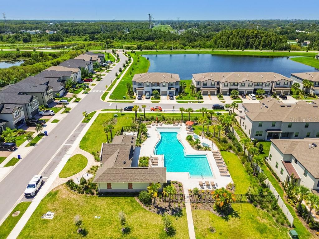 8331 Corner Pine Way New Port Richey, FL 34655 - Photo 39 of 41 an aerial view of a house with a swimming pool yard and outdoor seating