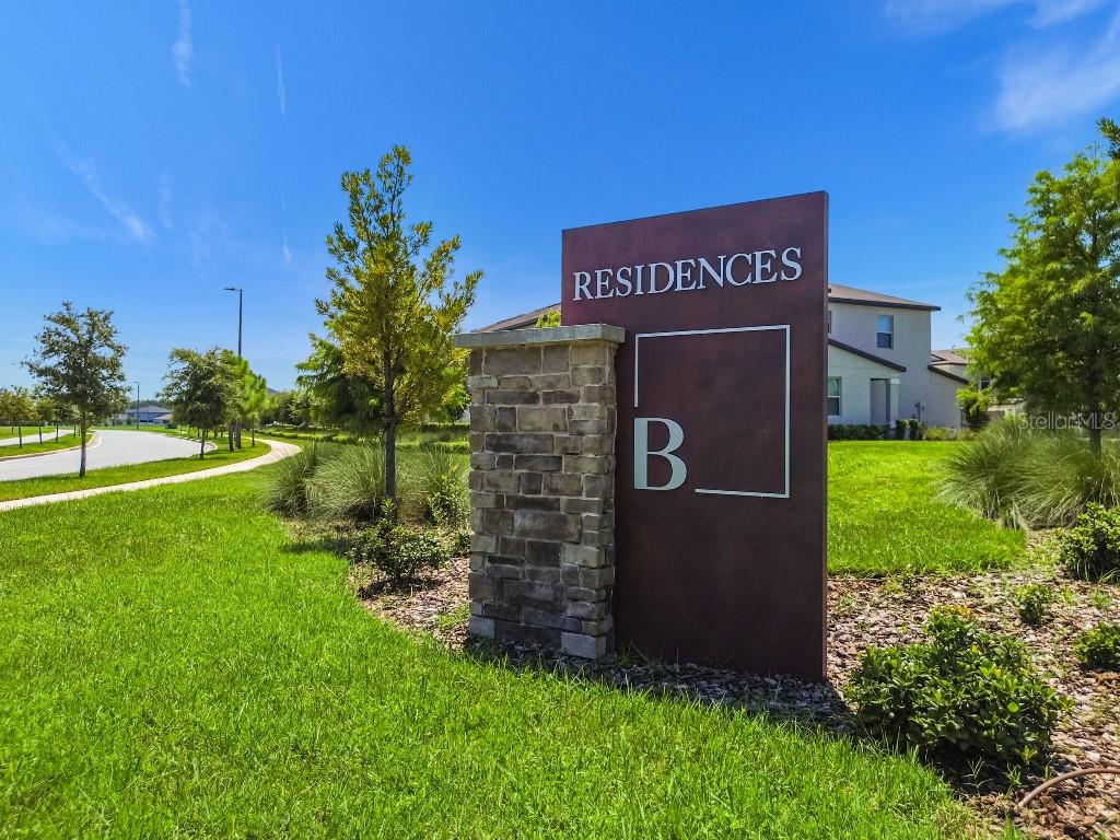 8331 Corner Pine Way New Port Richey, FL 34655 - Photo 41 of 41 a sign that is sitting in the grass near a building