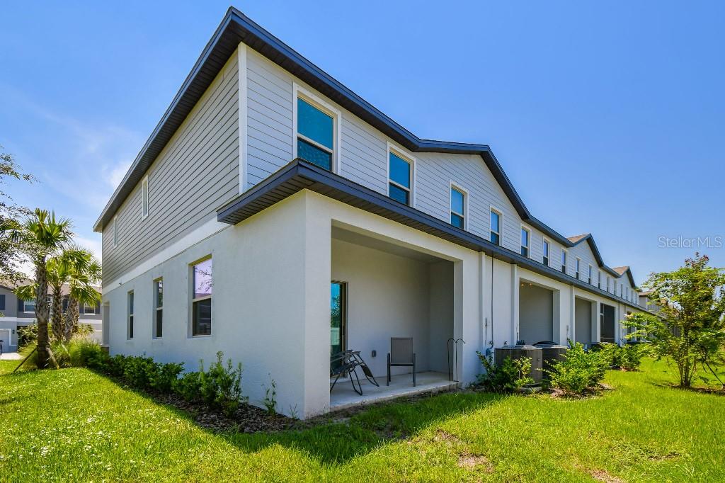 8331 Corner Pine Way New Port Richey, FL 34655 - Photo 8 of 41 a front view of house with yard