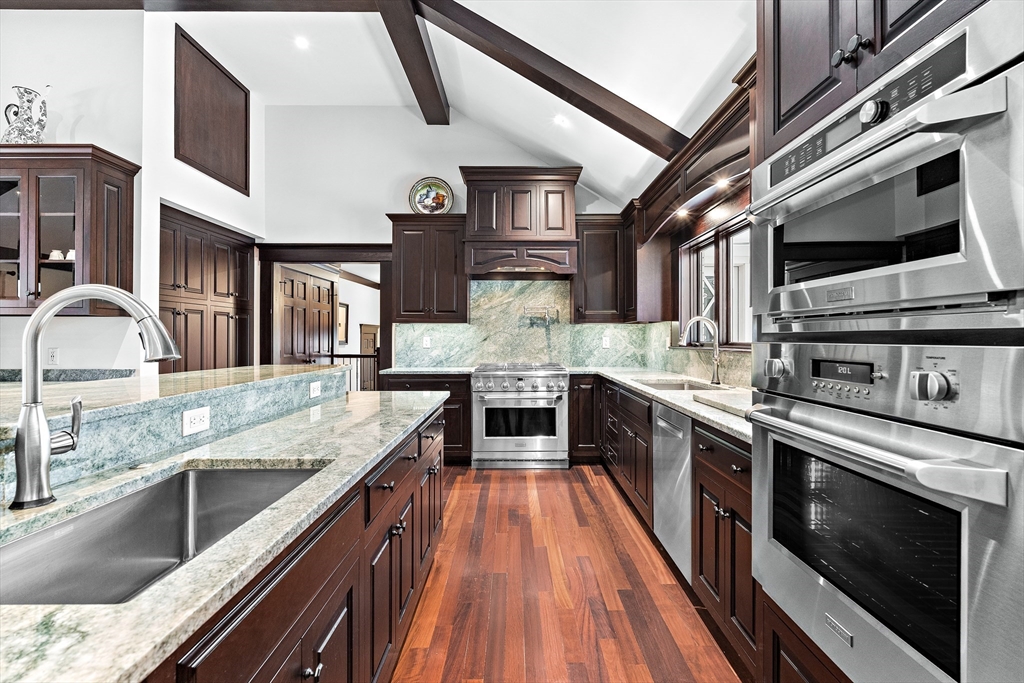 10 Viking Road Winchester, MA 01890 - Photo 16 of 42 a large kitchen with stainless steel appliances granite countertop a stove and a sink