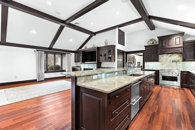 a kitchen with a stove and a sink
