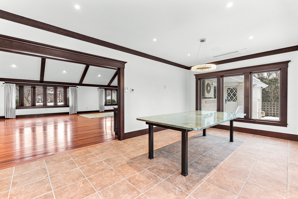 10 Viking Road Winchester, MA 01890 - Photo 20 of 42 a view of an empty room with a window and wooden floor