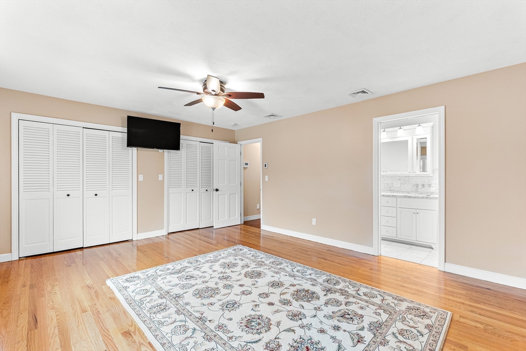 10 Viking Road Winchester, MA 01890 - Photo 24 of 42 a view of an empty room with a window and wooden floor