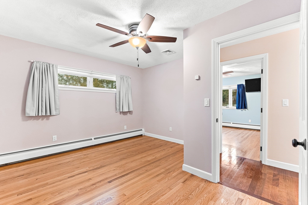 10 Viking Road Winchester, MA 01890 - Photo 26 of 42 wooden floor in an empty room with a window
